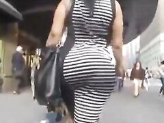 Huge butt in ebony and white dress