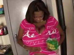 Black slut shows off her monster black tits